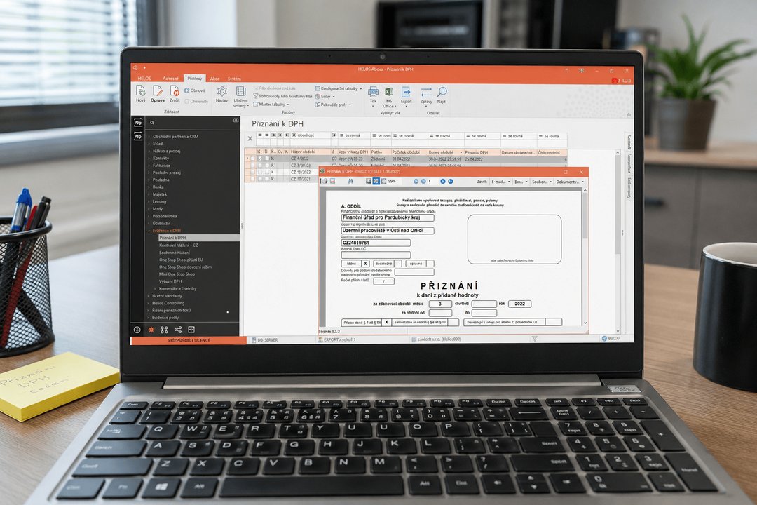 Otevřený notebook s ERP Helios a oknem modulu ekononika
